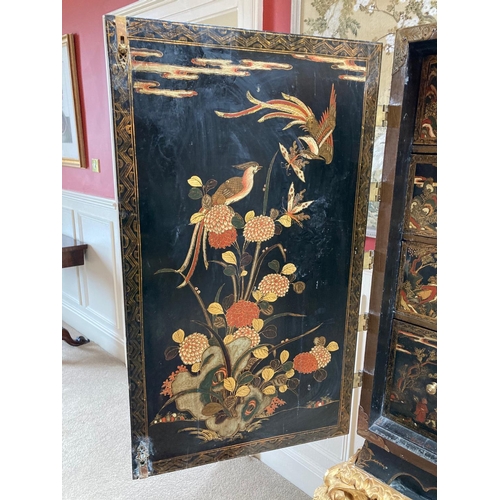 94 - An exceptional fine 18th Century chinoiserie lacquered two door Cabinet on Stand, the interior with ... 