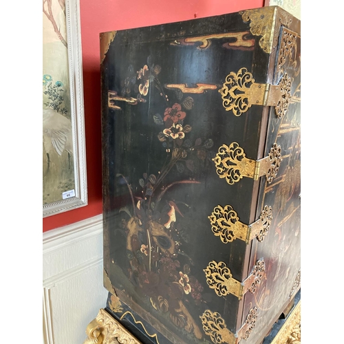 94 - An exceptional fine 18th Century chinoiserie lacquered two door Cabinet on Stand, the interior with ... 