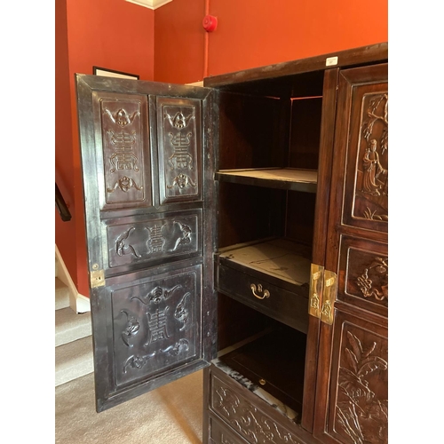 97 - A carved hardwood Cabinet (GUI) Qing Dynasty, of rectangular outline with a pair of hinged doors sep... 