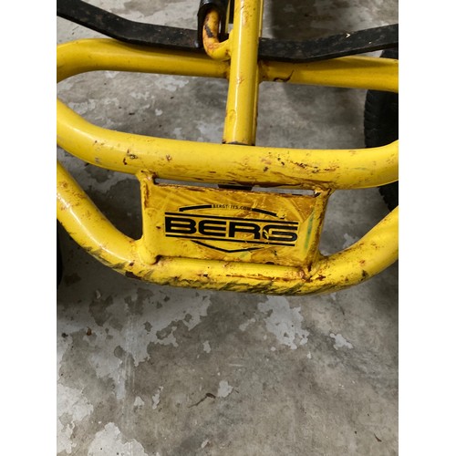 569 - A Child's double seat pedal action Go Cart, by BERG, painted yellow. (1)