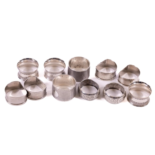 70 - A collection of 11 silver Napkin Rings, various shapes and dates, 240 grams. (11)