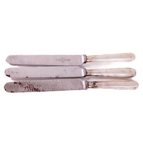 80 - A matched set of 24 - early 19th Century silver handled Dinner Knives, probably by Mark Bock, each w... 