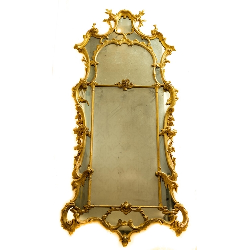 A fine quality George II giltwood Wall Mirror, with an arched cartouche cresting flanked by applied flowers, the central plate divided by a glazing bar with central floral motif, the scrolling sides flanking multiple drops either side, the conforming aprons with rockwork headed by icicles, some loss, otherwise in original condition, approx. 218cms x 100cms (87" x 40") (1)