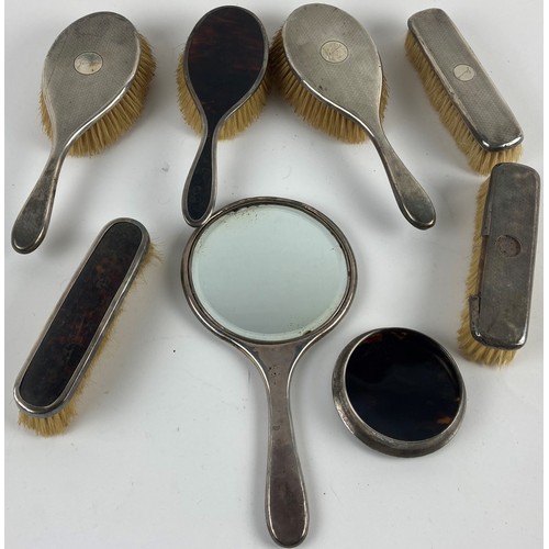 20A - Four silver backed Brushes, and a silver backed Hand Mirror; together with two silver mounted and fa... 