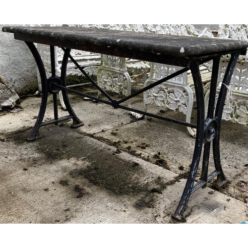 1362 - A heavy cast iron Patio Table, with marble top on curved supports, 140cms (55