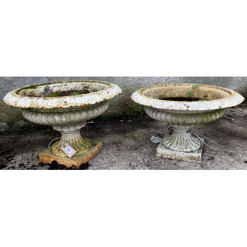 1349 - A pair of Victorian cast iron Garden Urns, with egg n' dart moulded rim, on square plinth base, each... 