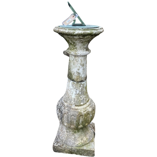 1383 - A composition stone Sundial, base with circular moulded top and bronze dial on fluted baluster stem ... 