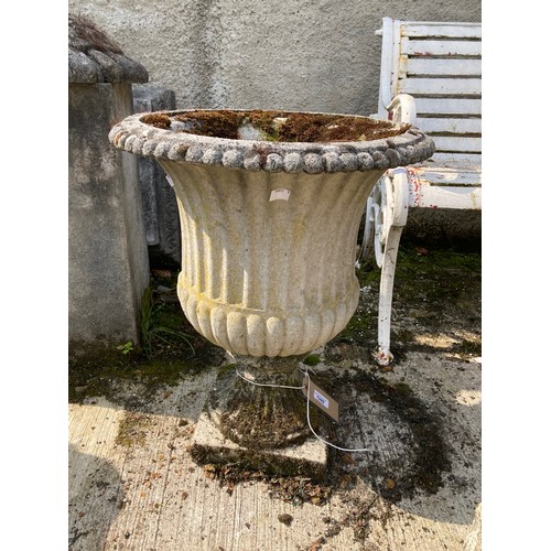 1389 - A composition stone Garden Urn, of campana form with half reeded and fluted body on square stem base... 