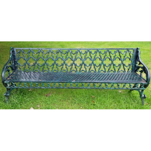 An extremely heavy Gothic Revival cast iron Garden Bench, the pierced back with typical gothic tracery, above a pierced cast iron honey comb seat above a conforming frieze and arched supports, 191cms (75"). (1)
