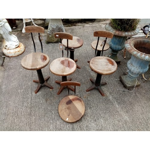 1395 - A set of early 4 Edwardian metal Factory Workers Chairs, each with heavy mahogany circular seats, an... 