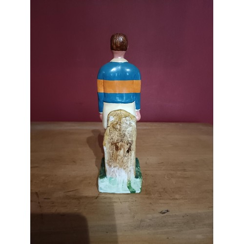 373 - G.A.A.: a hand painted plaster Figure of a hurler, 