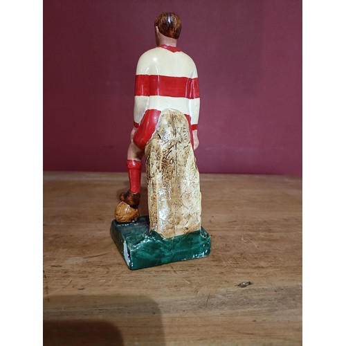 377 - G.A.A.: a hand painted plaster Figure of a Footballer 