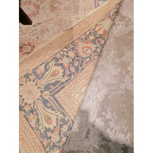 504 - A fine quality Middle Eastern Carpet, the central panel with cream ground and bouquet of flowers wit... 