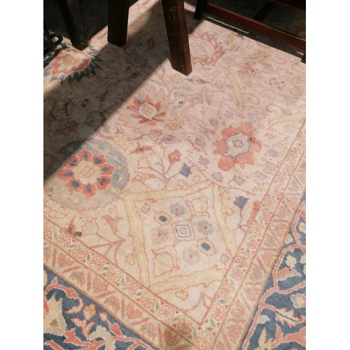 504 - A fine quality Middle Eastern Carpet, the central panel with cream ground and bouquet of flowers wit... 