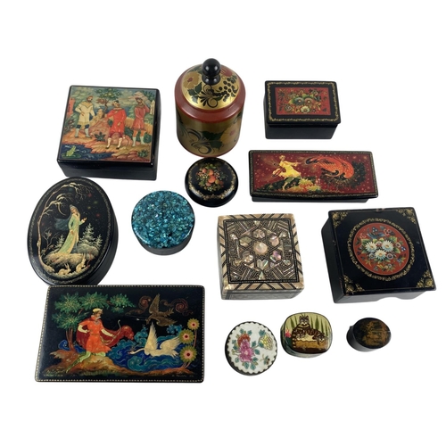 857 - A collection of lacquered and decorated Boxes, mainly Russian, some Signed  various sizes and shapes... 