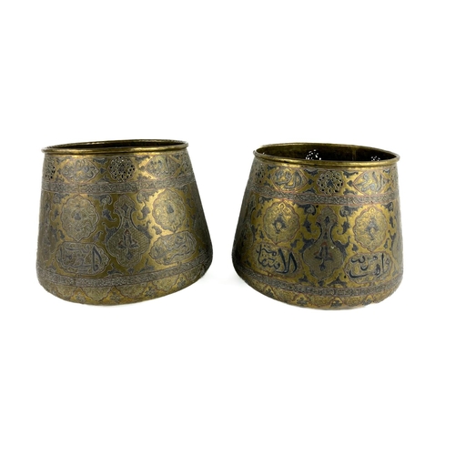 1031 - A pair of 19th Century brass Middle Eastern Jardinières, of pierced and embossed decoration depictin... 