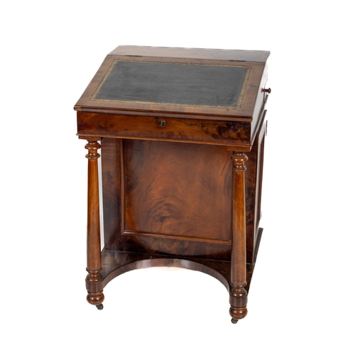 1052 - A late Victorian mahogany Davenport, with sloping hinged top raised on a single pedestal enclosing f... 