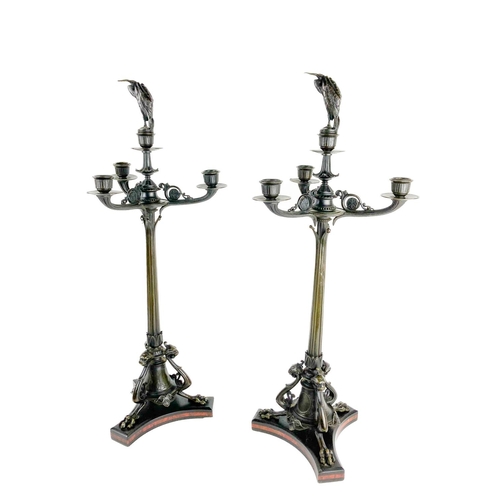 1069 - A good pair of bronze three branch four light Candelabra, in the Empire style, each centre light wit... 