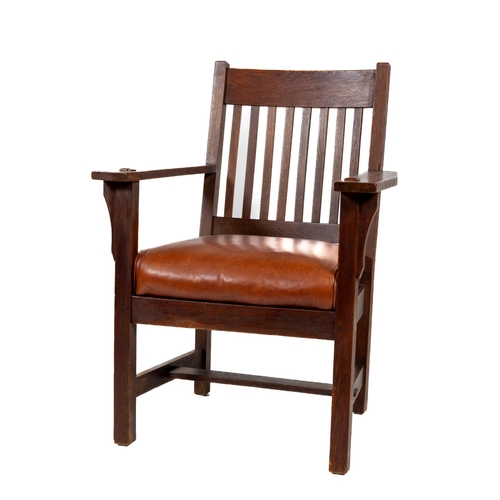 1090 - An early Stickley oak rail back Armchair, c. 1905, no markings, with boarded arm rests and padded le... 