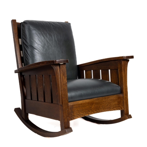 1092 - A large dark oak Stickley Rocking Chair, 89-401-R-3, June 17, 2005, with stamps and badge, the curve... 