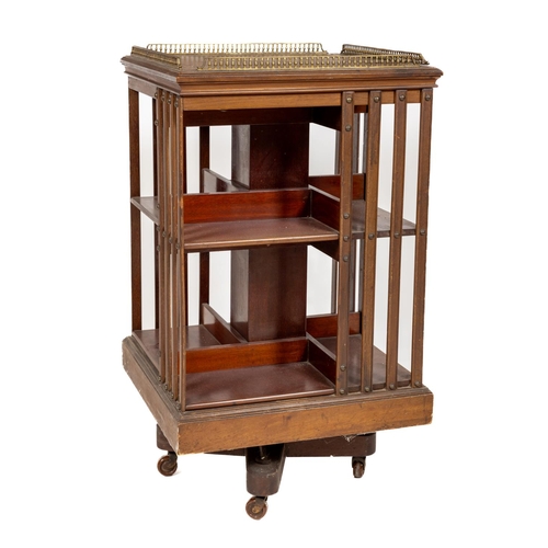 478 - An Edwardian mahogany square Revolving Bookcase, with four brass galleries and slatted sides, 89cms ... 