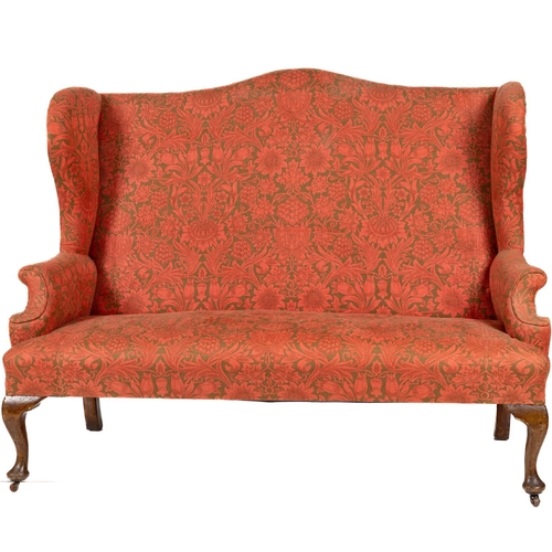 621 - A Queen Anne style walnut wing back two seater Settee, covered in attractive William Morris style re... 