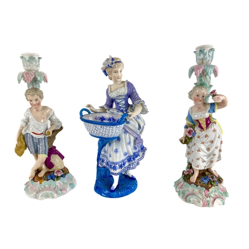 767 - A pair of Dresden Augustus Rex figural Candlesticks, modelled with boy and girl, 27cms (10 1/2