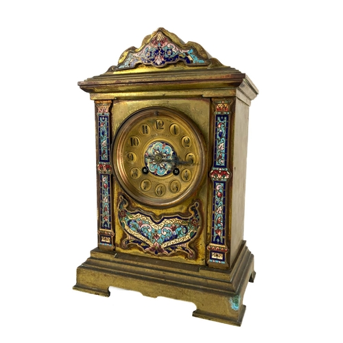 860 - A 19th Century French brass Mantle Clock, with champlevé panels and cornice, the circular dial with ... 