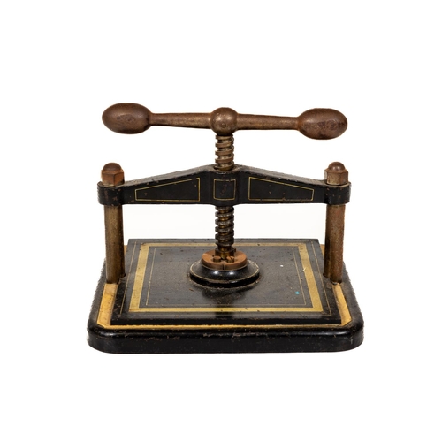 Lot - A cast iron book press, 19th century