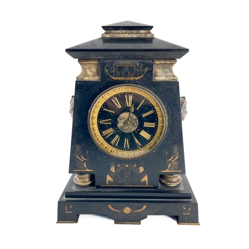 916 - A late Victorian Egyptian Revival polished slate Mantle Clock, with bronze mask mounts, the parcel g... 