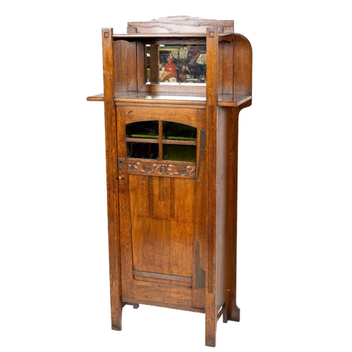 941 - A very good oak Arts & Crafts Cabinet, the shelved top above a recessed mirror panel above a doo... 