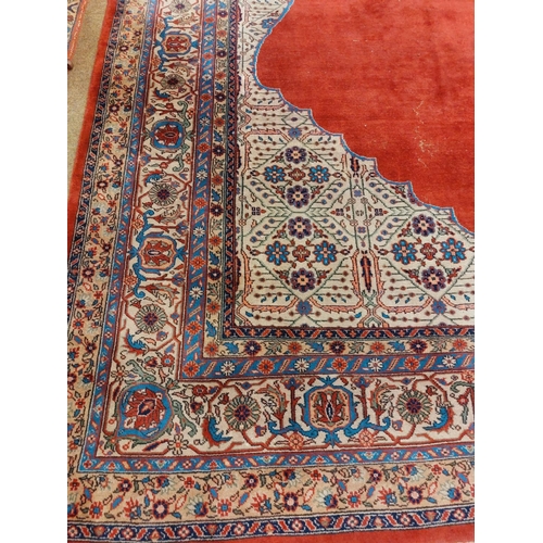 1113 - A very large burgundy ground Oriental wool Carpet, with large centre fawn floral medallion with conf... 