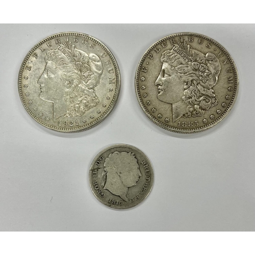 198 - Coins: A silver 1855 American One Dollar Coin, and a 1921 American One Dollar, a George III 1817 Sil... 