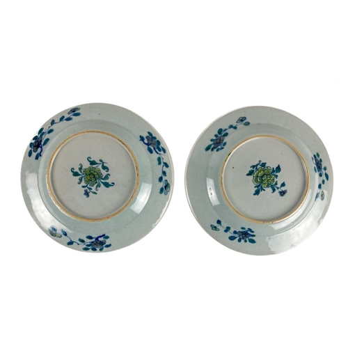 269 - A pair of attractive 18th Century Doucai Plates, Kangxi period, the central panels with figures in l... 