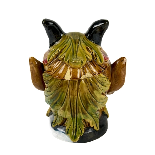 290 - A rare Continental Majolica type Biscuit Barrel, modelled as a horned bearded figure, stamped with n... 