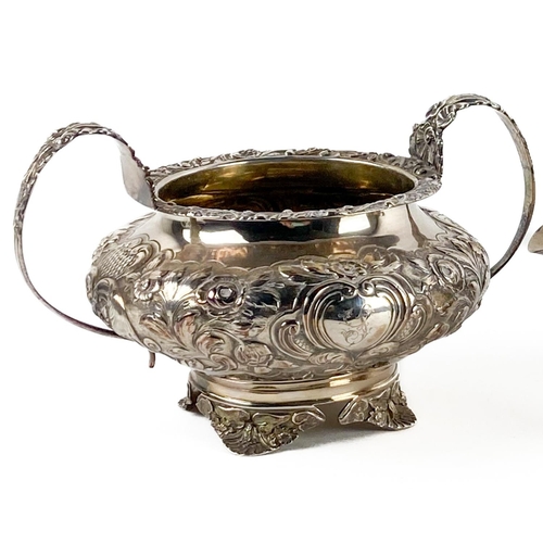 30 - A William IV period silver Tea Service, London 1834 by G.H., the Teapot with embossed decoration wit... 