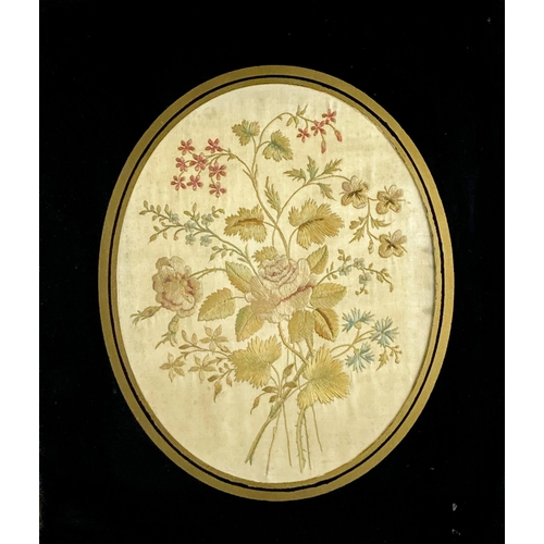 412 - A good oval silk Needlework Picture, depicting floral sprays, framed, 25cms x 20cms (9 3/4