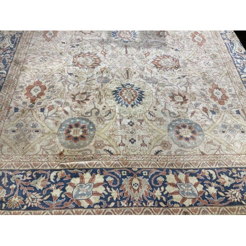 504 - A fine quality Middle Eastern Carpet, the central panel with cream ground and bouquet of flowers wit... 