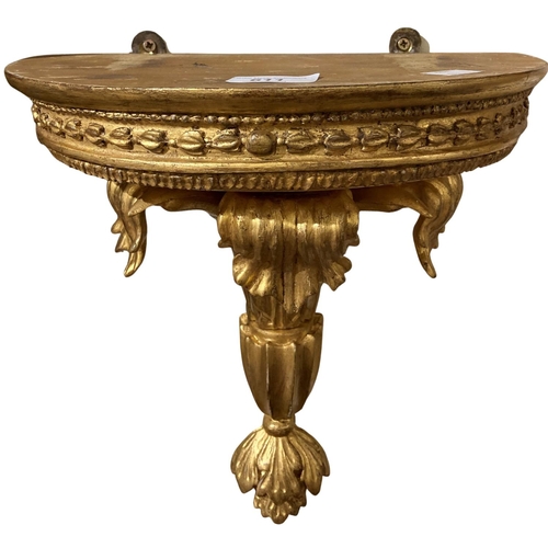 549 - A good pair of late 19th Century carved giltwood demi-lune Wall Brackets, the shelf moulded with bea... 