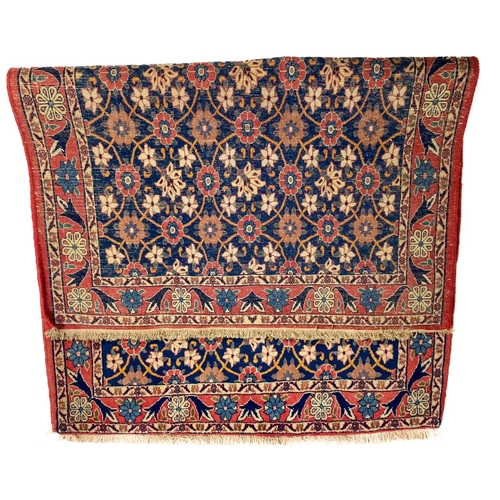 657 - A fine quality Persian Rug, the floral field in navy blue with a series of ovals and half ovals unit... 