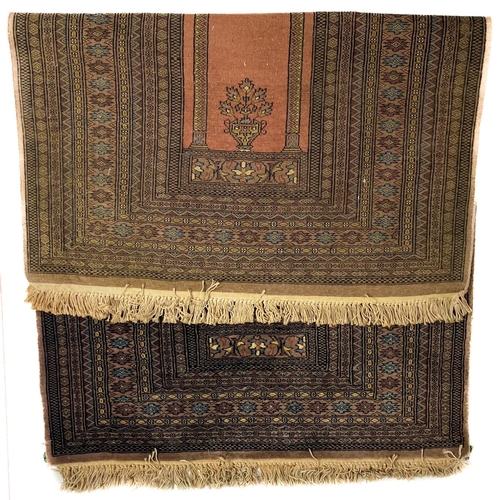 717 - A fine large dark multi border Persian Prayer Rug, with two columns and arched top on a rust ground ... 