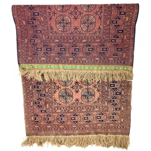 727 - A large rust ground Bokhara Rug, with two rows of octagons inside a multi border, 194cms x 110cms (7... 