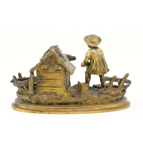 960 - An attractive 19th Century gilt bronze Inkstand, modelled with a young boy feeding a dog by a kennel... 