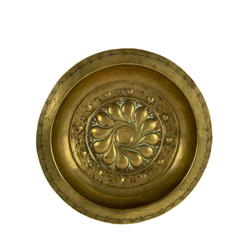 981 - A 17th Century Nuremberg brass Alms Dish, with central floral design, approx. 30cms (12'') diameter.... 