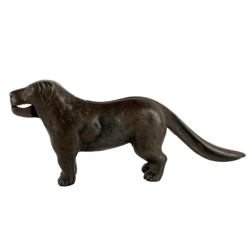 696 - A heavy bronze Novelty Table Nut Cracker, modelled as a dog, with hinged tail mechanism. (1)... 