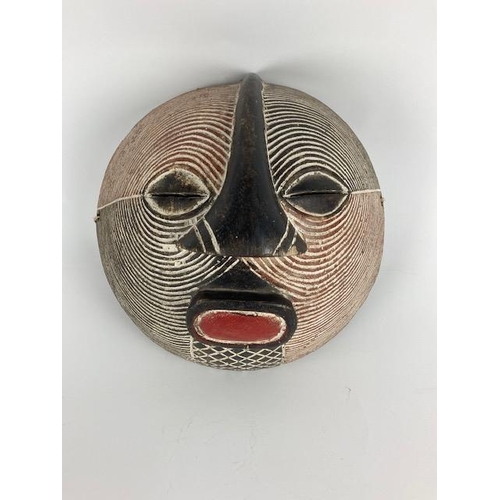 258 - A carved Vintage African Luba Kifwebe Mask, Dem. Rep. of Congo, with reeded spirals, oval pierced ey... 