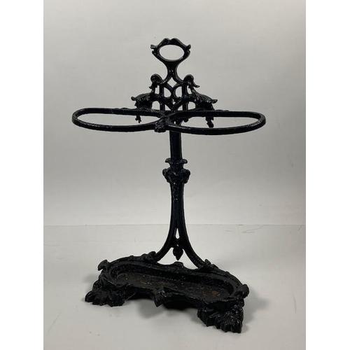 441 - A Victorian cast iron Coalbrookdale Stick and Umbrella Stand, with carrying handle, above two holder... 