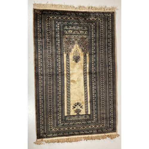 503 - A fine Afghan Prayer Rug, the beige centre with two columns supporting an arch inside a multi-band b... 