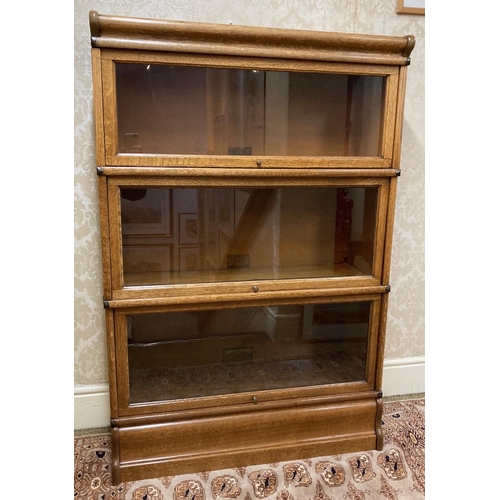 527 - A globe Wernicke oak Bookcase, five sections with up and over glazed doors, all labelled on a short ... 