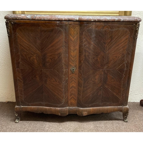 707 - A large French Side Cupboard, of serpentine form, with heavy moulded rouge and speckled marble top a... 